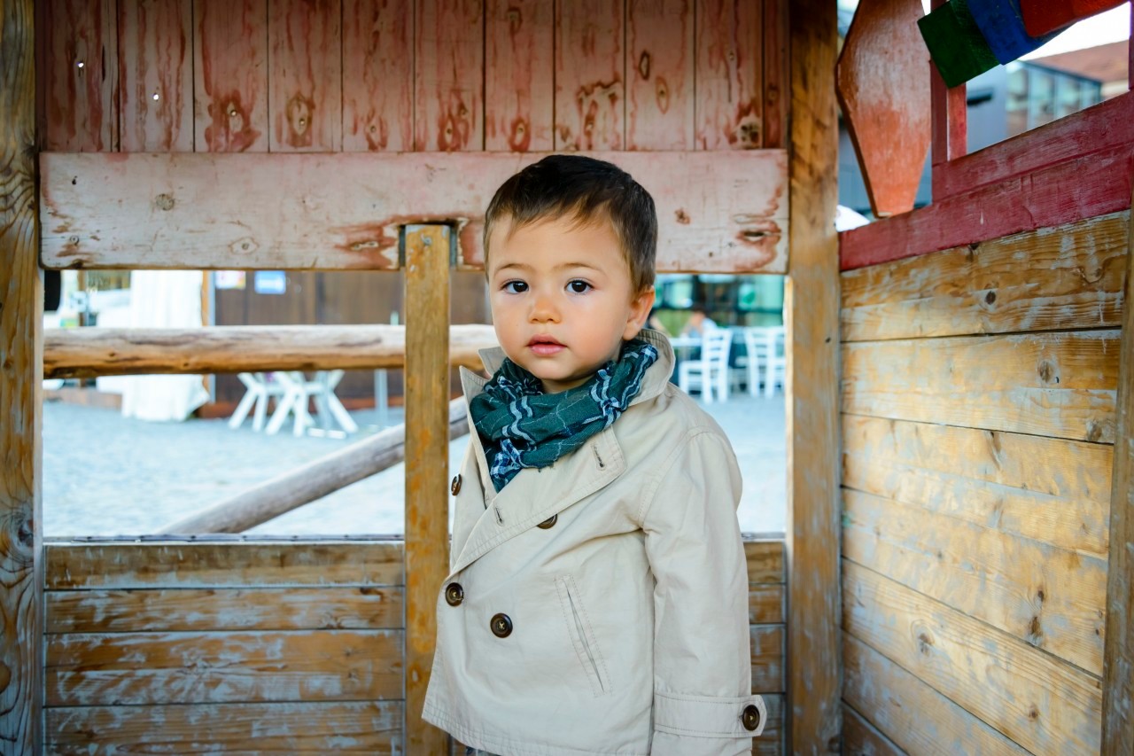 Portrait of Baby Boy in Wooden Play House --- Image by © Radius Images/Corbis