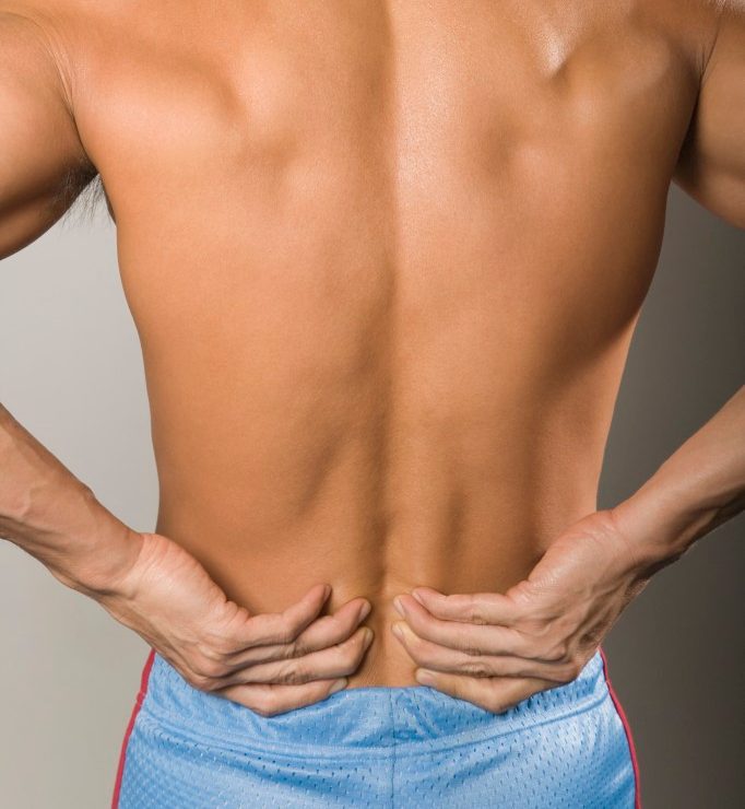 Man with Backache --- Image by © Radius Images/Corbis