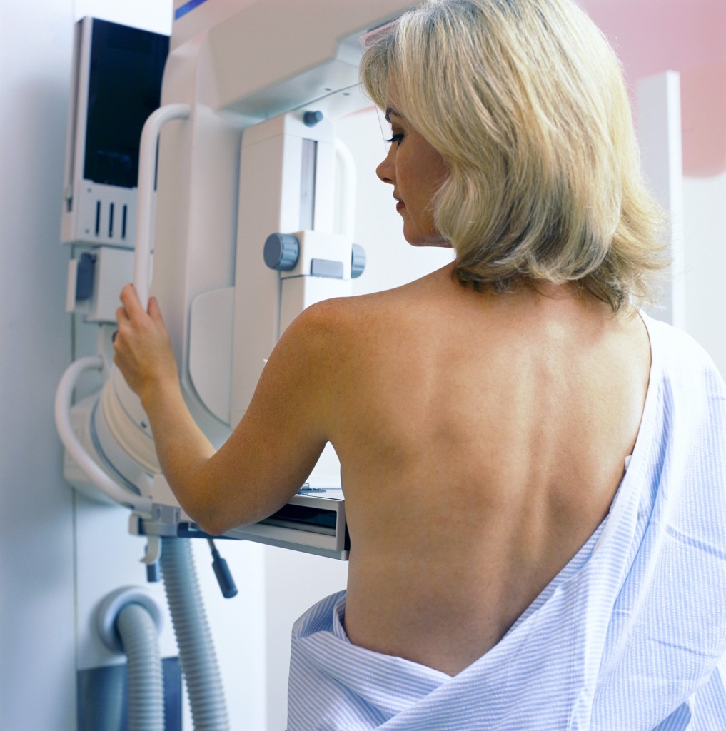 San Diego, California, USA --- Woman receiving mammogram in clinic --- Image by © David Leahy/Juice Images/Corbis