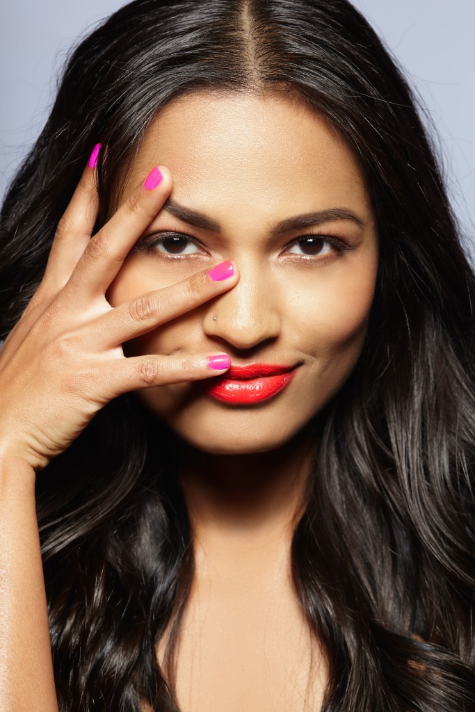 21 Oct 2014 --- Female model covering face with fingers --- Image by © Corina Marie Howell/Corbis