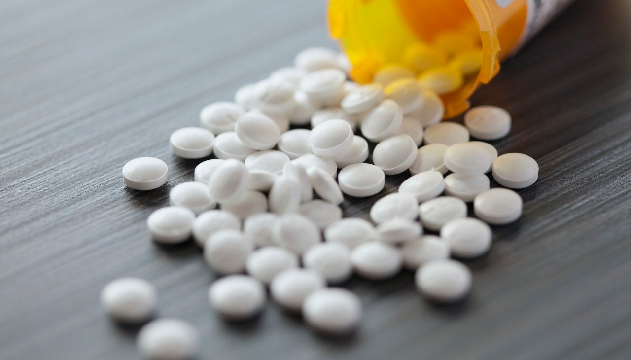 10 Apr 2012 --- White pills spilled on table. --- Image by © Hero Images/Corbis