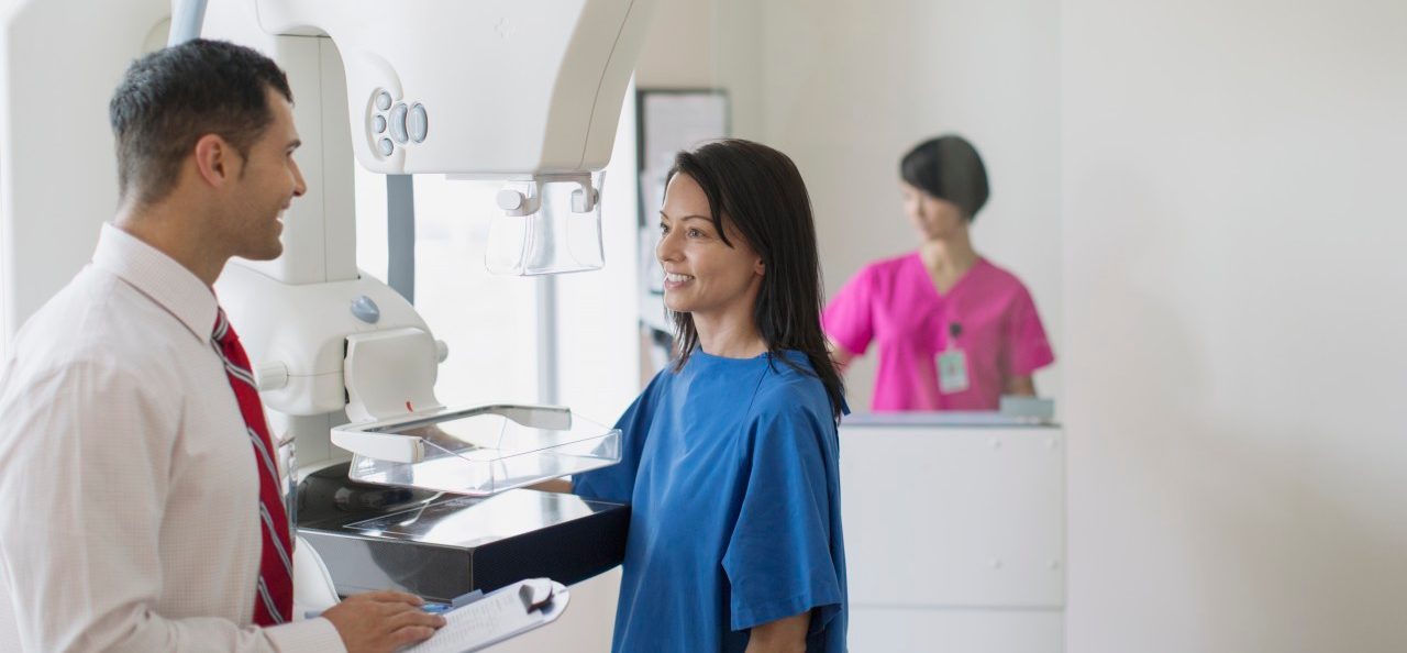 17 Jul 2012 --- Doctor talking with patient about mammograph procedure. --- Image by © Hero Images/Corbis