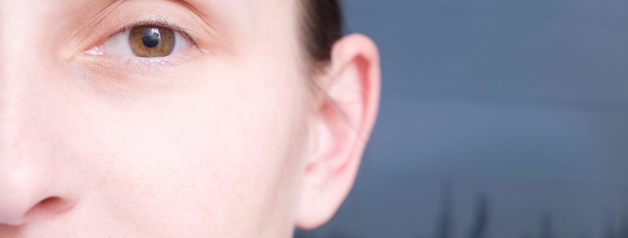 Close up of cropped woman face sound wave graph in background --- Image by © Vladimir Godnik/moodboard/Corbis
