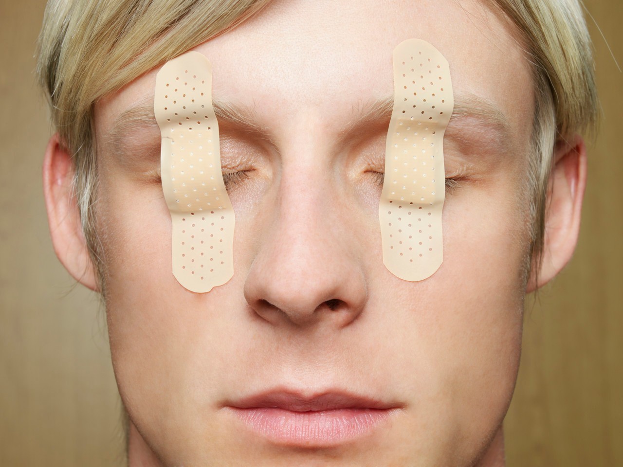 Man with bandages over eyes --- Image by © Bernd Vogel/Corbis