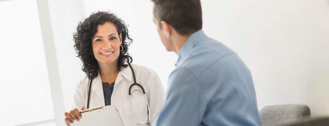 03 Jun 2014 --- Doctor talking with patient --- Image by Â© Tetra Images/Corbis