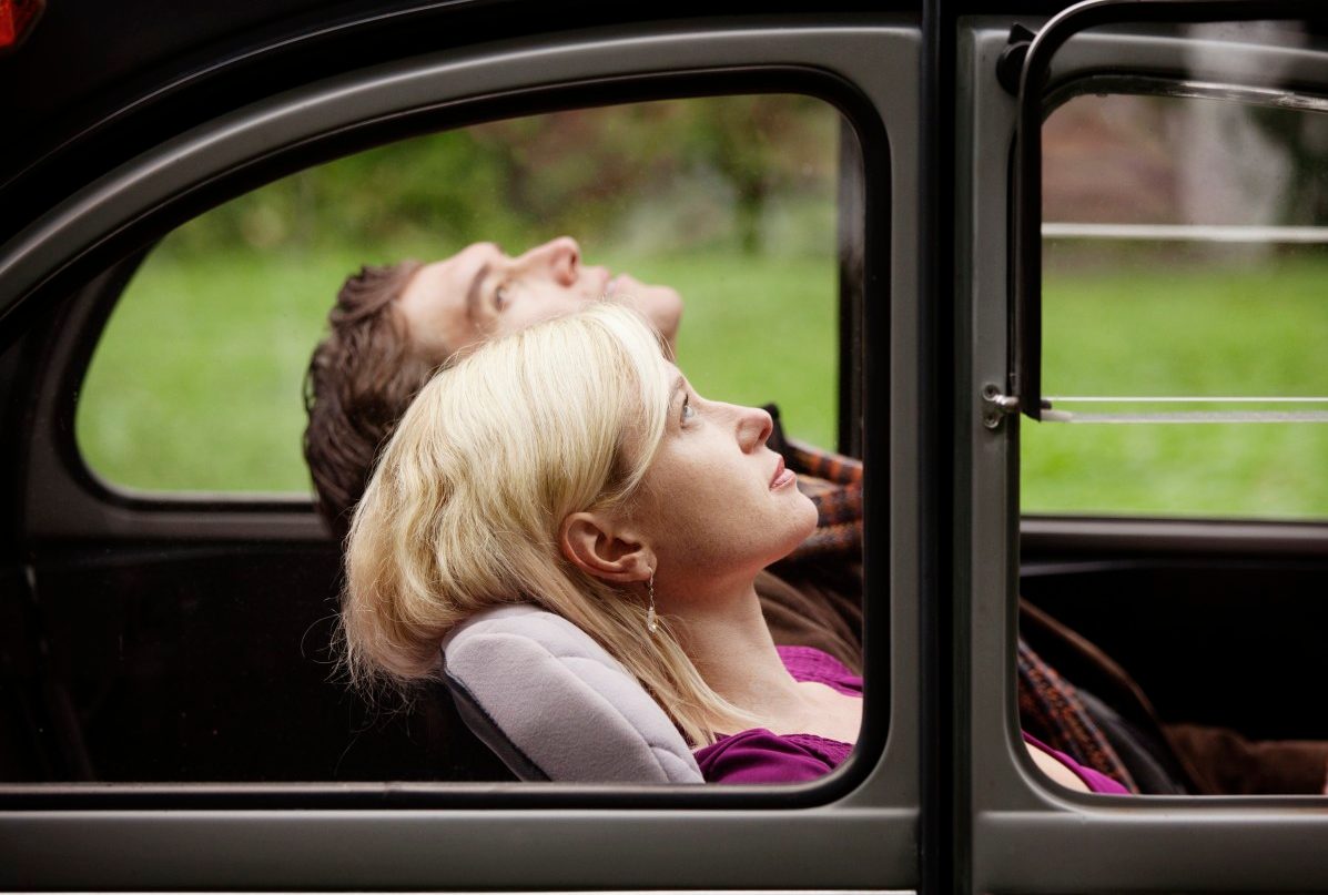 26 Sep 2012 --- Couple relaxing in old car --- Image by © Cavan Images/Corbis