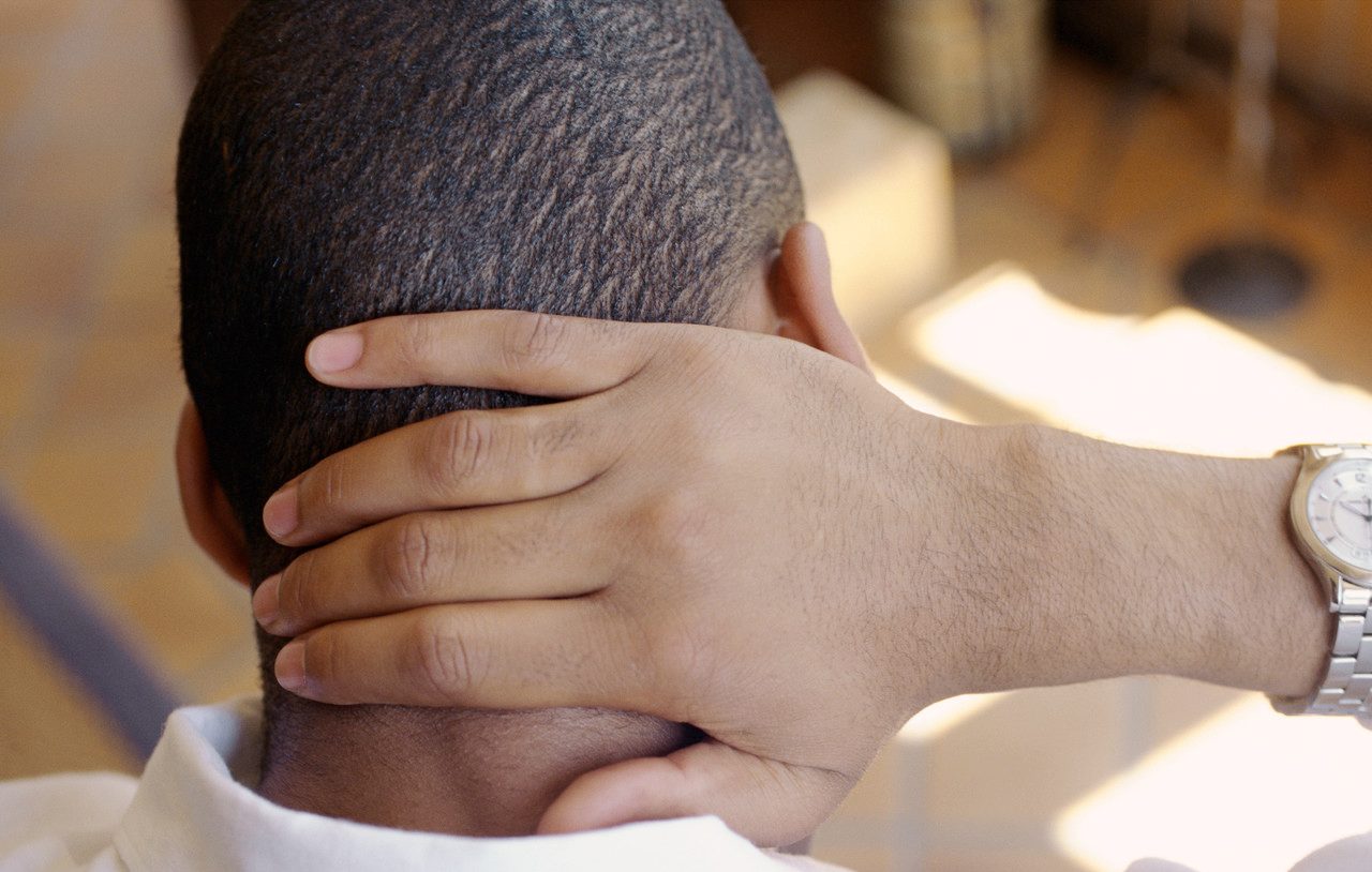 Man, Hand On Back Of Neck, Rear View, Close-up --- Image by © Vera Atchou/PhotoAlto/Corbis