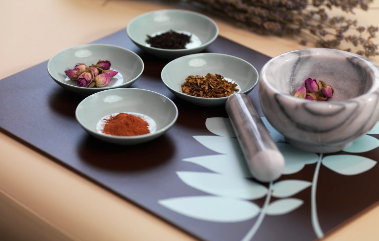 Mortar and Pestle with Dried Herbs --- Image by © Radius Images/Corbis