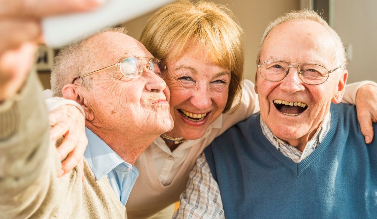 13 Feb 2015 --- Cheerful seniors taking selfie --- Image by © Uwe Umstätter/Westend61/Corbis