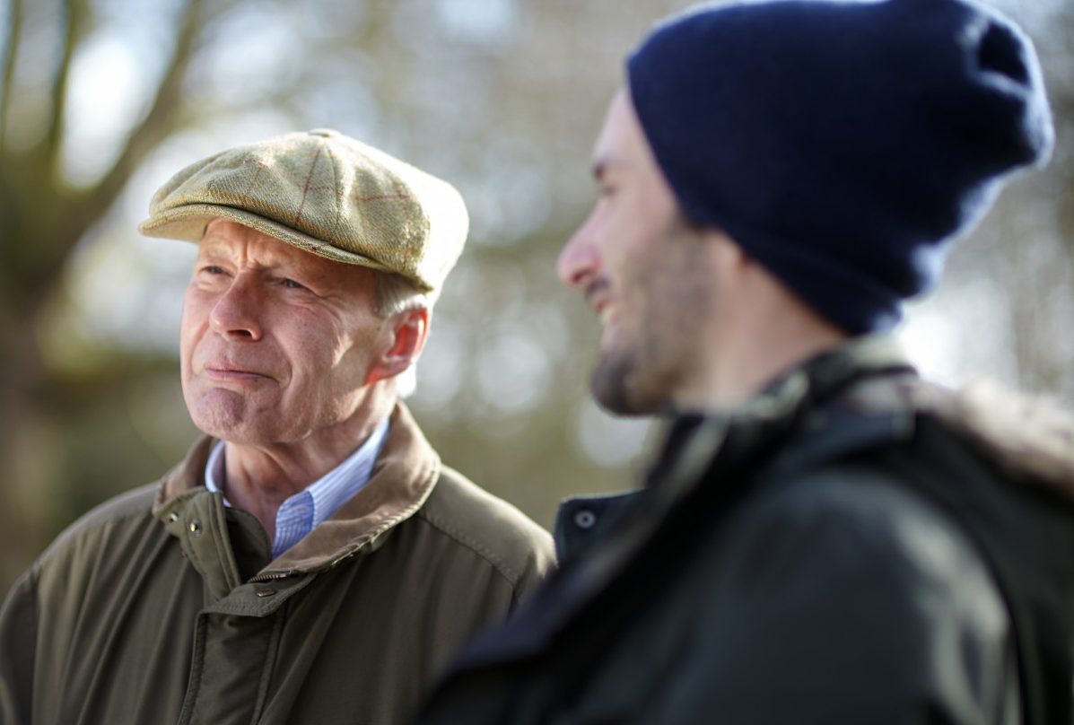 Senior father with son talking together outside --- Image by © MKeal/Corbis