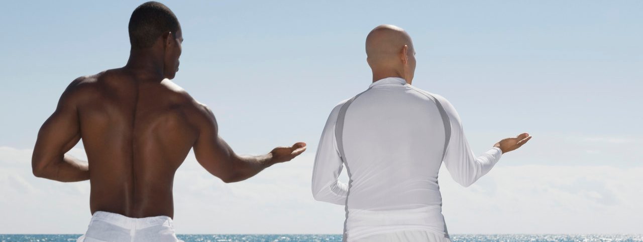 Miami, Florida, USA --- Men practicing tai chi --- Image by © Visual Ideas/Nora Pelaez/Blend Images/Corbis