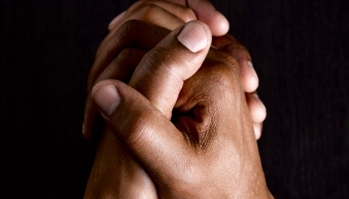 Business man with hands clasped together --- Image by © Le Club Symphonie/cultura/Corbis
