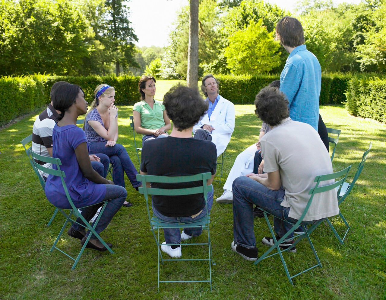 Circle of people in rehab, outdoors --- Image by © Ghislain & Marie David de Lossy/cultura/Corbis