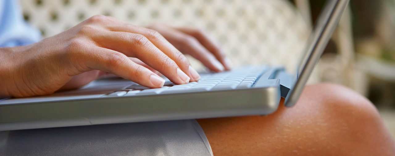 Woman Using Laptop --- Image by © Ant Strack/Corbis